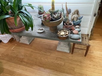 A BLUE STONE SLAB BENCH/TABLE