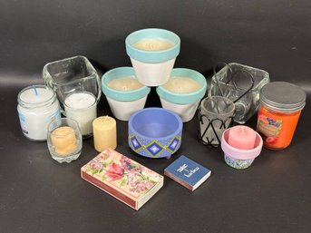 An Assortment Of Candles & Candle Holders