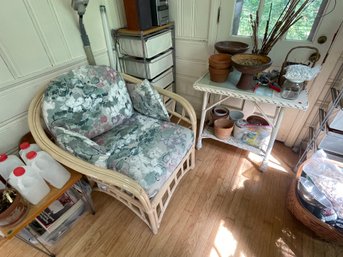 A RATTAN SIDE TABLE AND ARMCHAIR