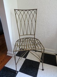 A Metal Chair With Gold Finish