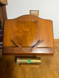 A BRASS KALEIDOSCOPE AND A BOOK STAND