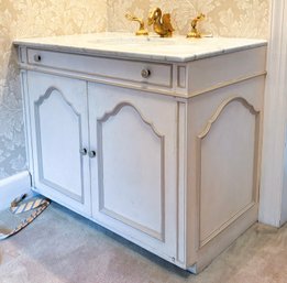 A Vintage Marble Top Vanity With Paneled Doors And Brass Fittings By Sherle Wagner