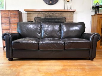 A Vintage Chocolate Leather Rolled Arm Sofa With Nailhead Trim
