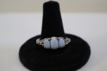 925 Sterling Silver With Light Blue Stones And Clear Stones Down Sides Ring Size 11 Marked STS Chuck Clemency