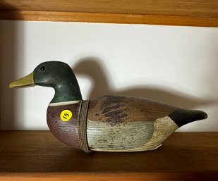 A CARVED DUCK DECOY SIGNED WHITE