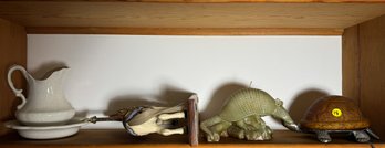 DECORATIVE LOT INCLUDES TURTLE LAMP, ARMADILLO CANDLE, A CAROUSEL HORSE, AND MORE