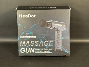 A Massage Gun With Accessories By HeaDot