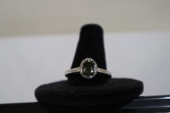 925 Sterling Silver With Green Center Stone With Clear Stones Around Ring Size 10 Marked STS Chuck Clemency