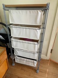 A CONTEMPORARY ROLLING CART WITH FABRIC DRAWERS