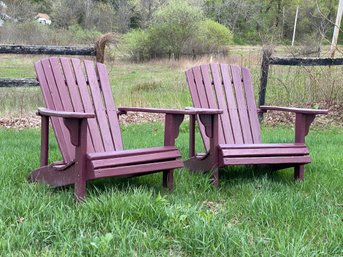 A Pair Of Classic Wood Adirondack Chairs With A Painted Finish