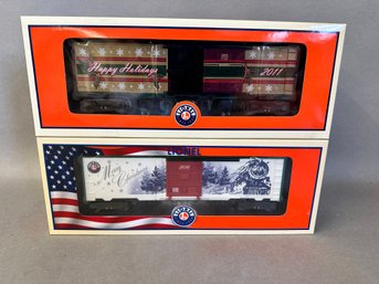 NIB Lionel Trains: 2014 Christmas Box Car & 2011 Lionel O Gauge Christmas Box Car, 6-81733 & 6-29975