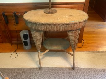 A VICTORIAN RATTAN/WICKER TABLE