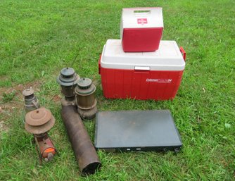 Camping Lot With Lanterns Coolers And Stove