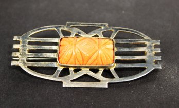 ART DECO STERLING SILVER BROOCH HAVING CARVED CORAL STONE