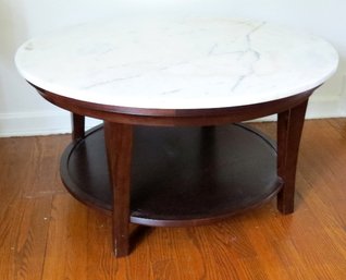 A Majestic 35' Diameter Marble Topped Coffee Table