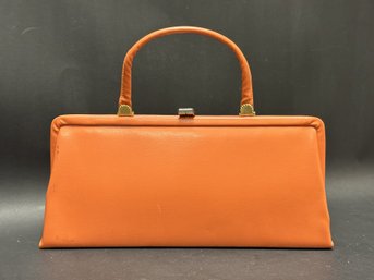 A Stylish Vintage Mid-Century Ladies Handbag In Bright Orange