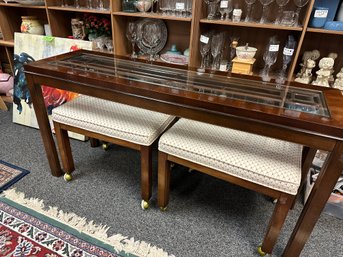 Sofa Table With Asian Flair  Glass Panel And Two Upholstered Benches On Wheels