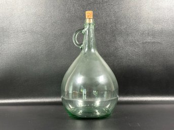 A One-Gallon Jug In Light Green Glass With Cork Stopper