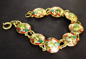 VINTAGE GOLD TONE ENAMEL AND GREEN CAB STONE BRACELET CELTIC DESIGN