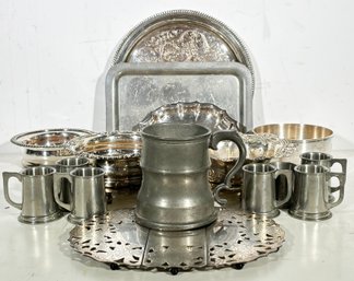 A Group Of Silver Plated And Pewter Serving Ware