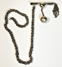 Bizarre Silver Chain Having Modernist Fob?