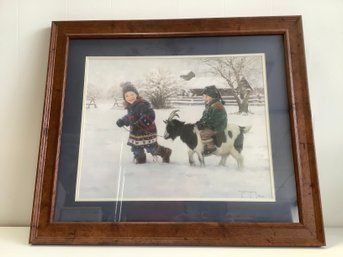 Kids Playing With A Goat In The Snow Framed Print