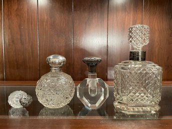 Four Antique Glass And Sterling Silver Parfum Bottles.