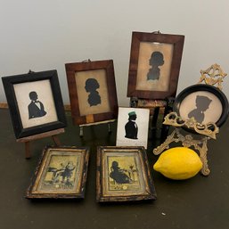 A Collection Of Antique Silhouettes And Easels