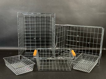 An Assortment Of Chrome Wire Bins