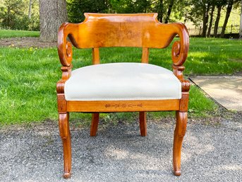 An Antique Carved Maple Arm Chair