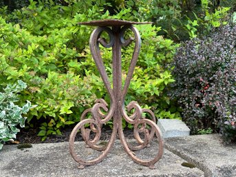 A Vintage Plant Stand In Scrolled Metal With A Naturally-Aged, Rusty Patina