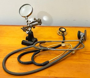 Antique Stethoscopes And A Magnifying Glass