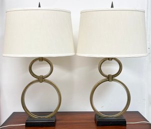 A Pair Of Figure 8 Designer Brass Lamps