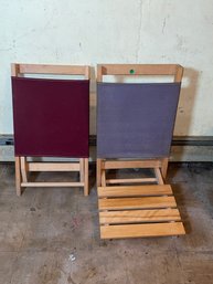 TWO WOOD AND CANVAS FOLDING CHAIRS