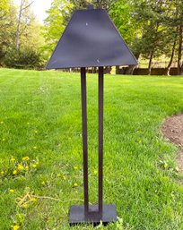 A Modern Bronze Standing Lamp With Bronze Shade