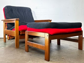 A Modern Mahogany Arm Chair And Ottoman Turned Futon