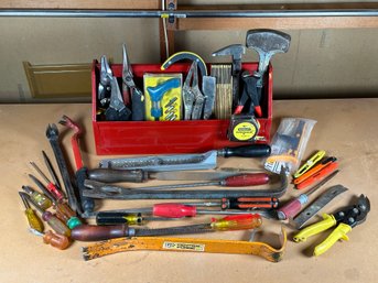 A Large Assortment Of Hand Tools In A Red Metal Carry-All