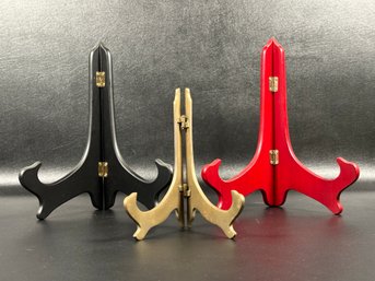 Three Display Stands In Black, Gold & Red