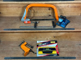 A Small Assortment Of Tools: Saw, Stud Finder, Clamps & Vise