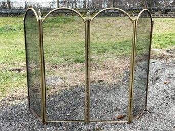 A Fireplace Screen In Brass And Mesh