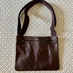 A Longchamp Swing Pack Leather Messenger Bag