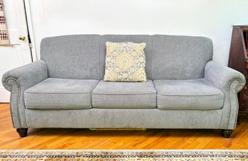 A Rolled Arm Sleeper Sofa With Nailhead Trim - Great Look And Convenient For That Guest Room!