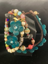 Three Bracelets Costume And Fun Flowers Beads And One Have Blue Flowers Beads And More