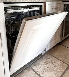 A Miele Incognito Dishwasher With Custom Paneled Wood Front