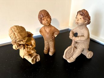 3 Children Carved In Clay