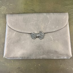 A Vintage Ferragamo Blue Leather Clutch With Suede Flower Embellishment