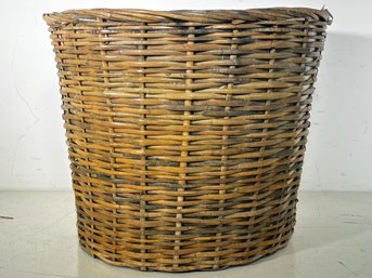 A Lined Wicker Waste Basket