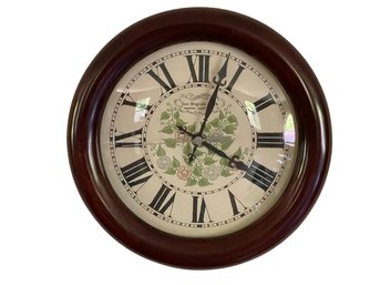 12 In Wood Framed Clock W/ Roman Numerals & Floral Design By The New England Clock, Bristol CT.