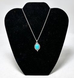 A Turquoise Pendant In Sterling Silver Setting