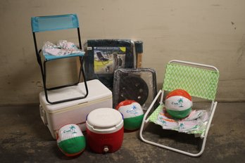 Outdoor Lot With Coolers, Chairs And Beach Balls